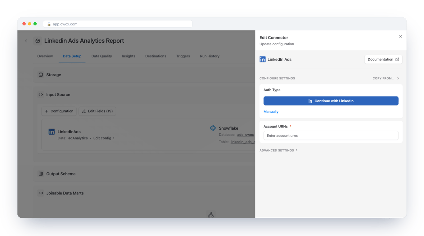 Edit Connector form for LinkedIn Ads in OWOX Data Marts on a Snowflake Data Mart, with a Continue with LinkedIn button, a Manually link and a required Account URNs field – one sign-in and the account ID connect the source