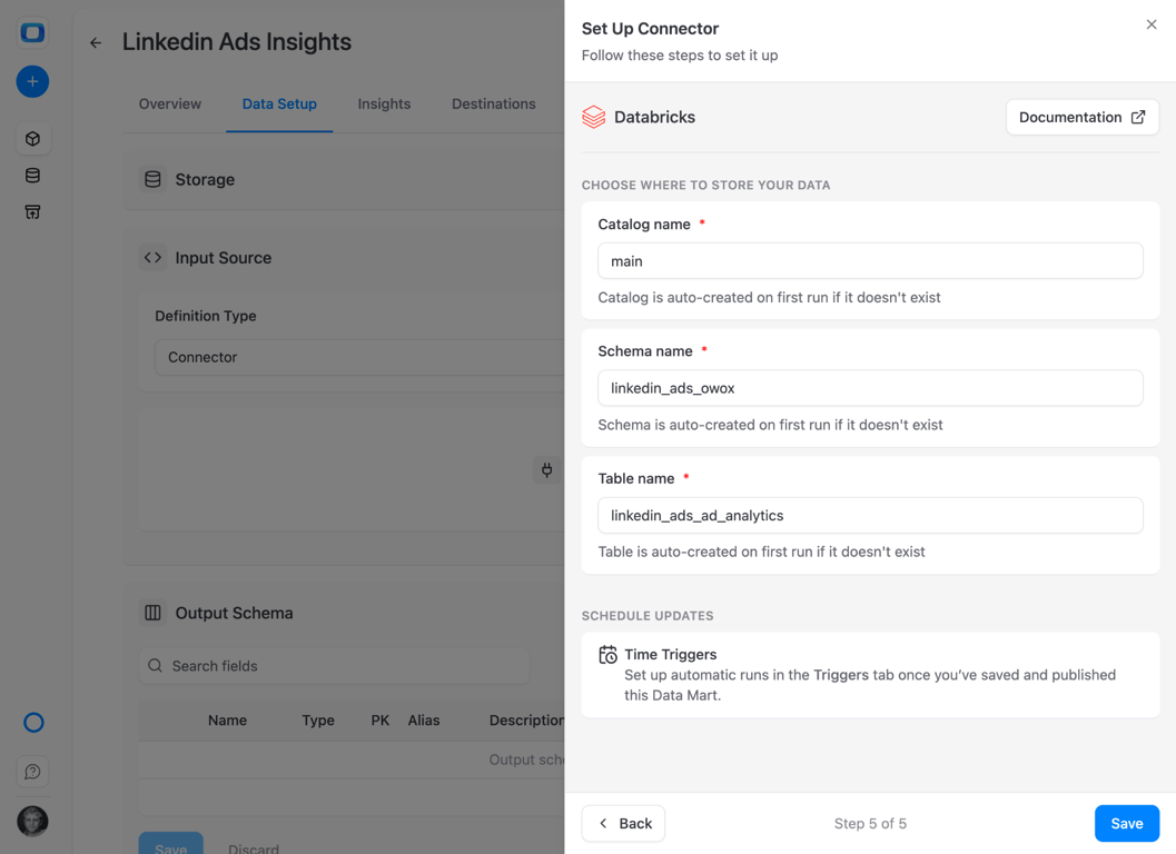 Set Up Connector dialog in OWOX Data Marts, step 5 of 5, with Catalog name set to main, Schema name linkedin_ads_owox and Table name linkedin_ads_ad_analytics, each noted as created on first run if it does not exist – the destination is a three-level Unity Catalog name