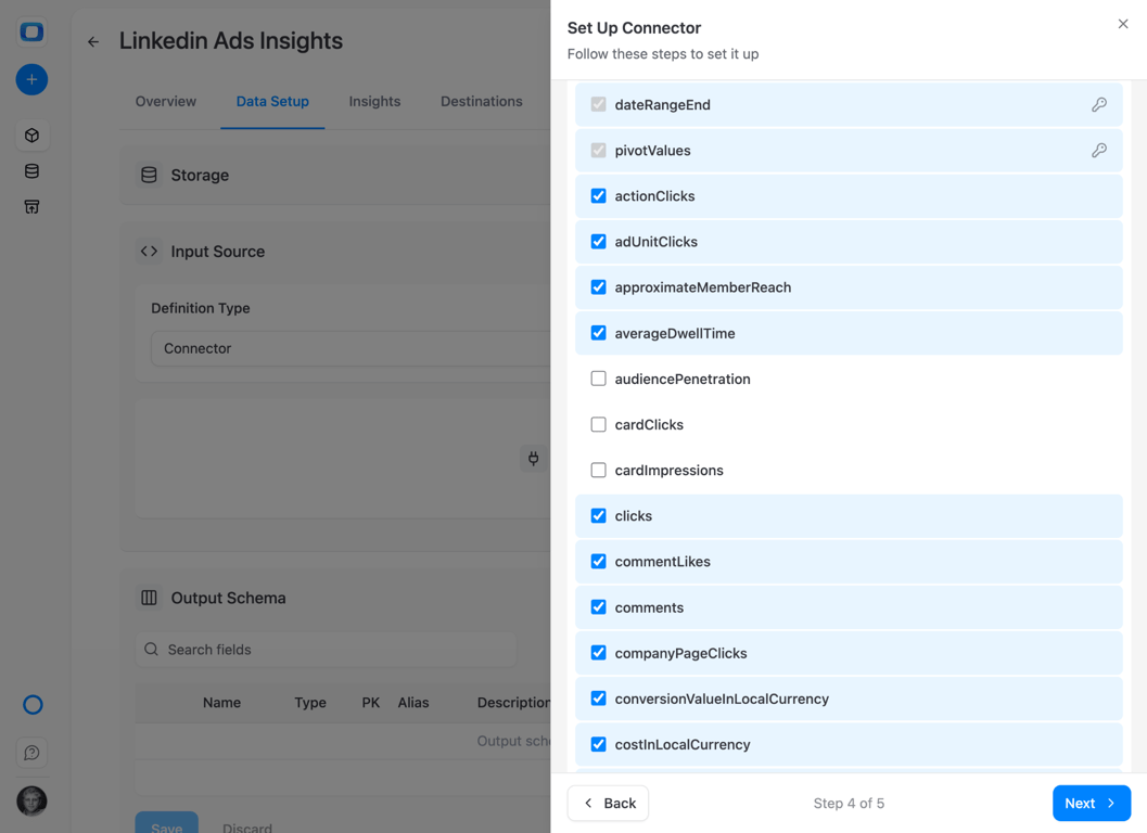 Set Up Connector dialog in OWOX Data Marts, step 4 of 5, with LinkedIn Ad Analytics fields: dateRangeEnd and pivotValues locked as keys, and actionClicks, adUnitClicks, clicks, comments and costInLocalCurrency ticked – a row is identified by its date and its pivot values, not by a campaign name